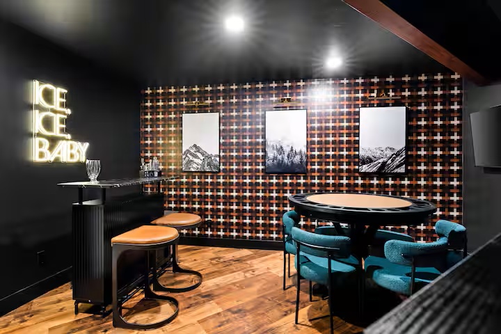 Private speakeasy with poker table, bar and neon sign